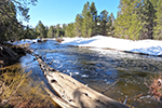 Upper Truckee River in spring with snow along the banks.