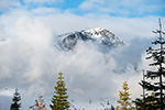 The summit of Mount Tallac appears from behind the clouds.