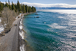 An aerial view of people walking along the Lake Tahoe shoreline on California Tahoe Conservancy land in Placer County.