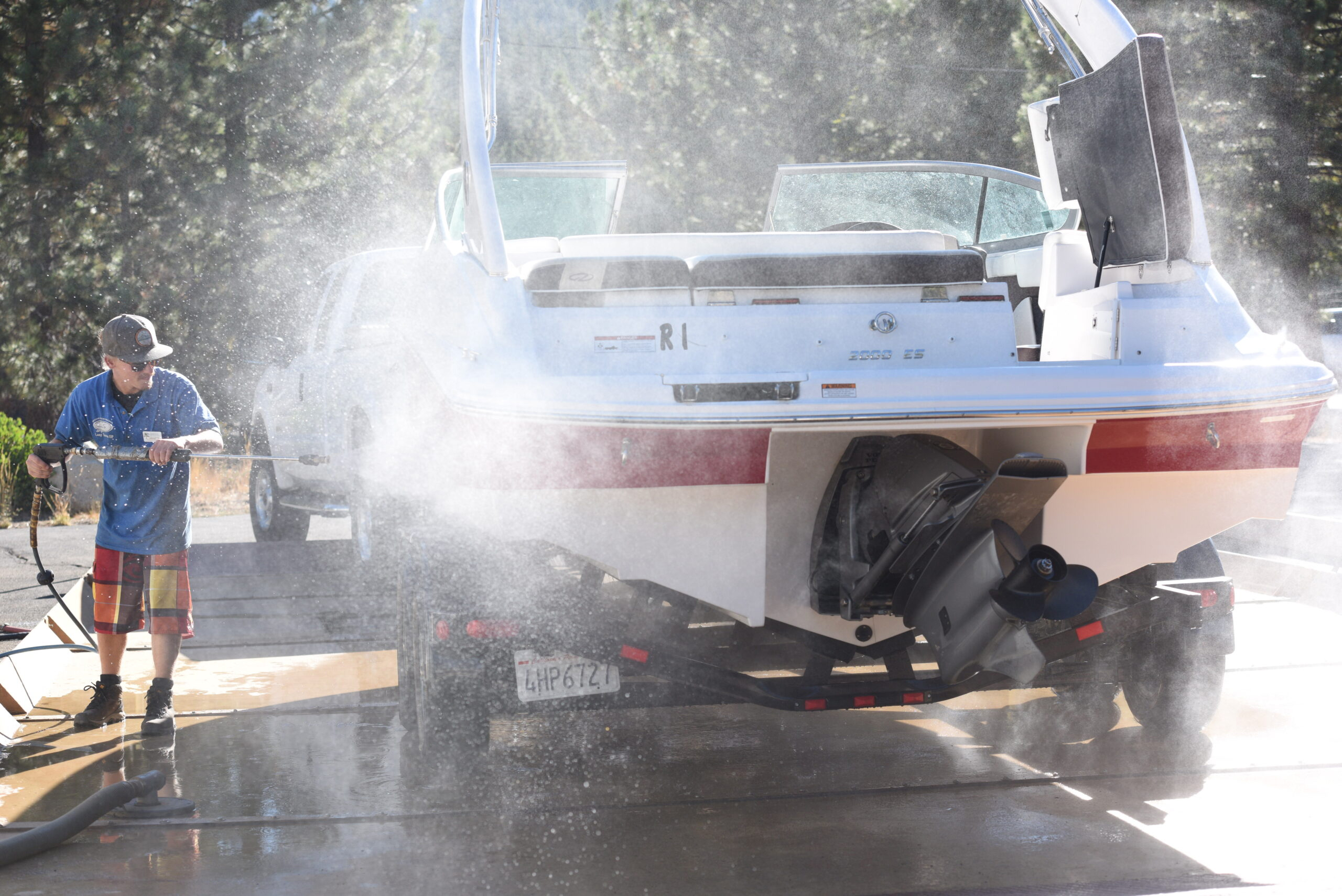 A person working at a watercraft inspection station to prevent aquatic invasive species from entering Lake Tahoe.