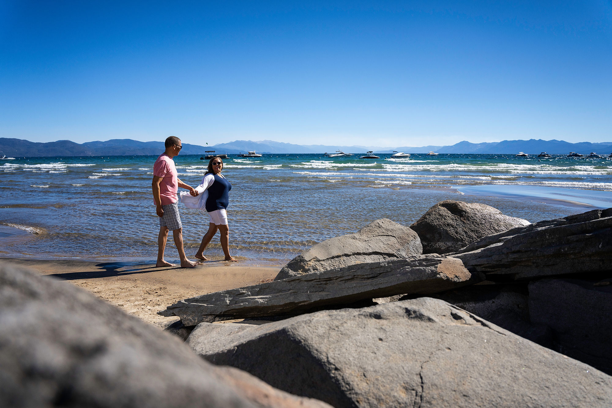 People walking the beach at Lake Tahoe