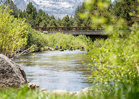 People paddling on the Upper Truckee River.
